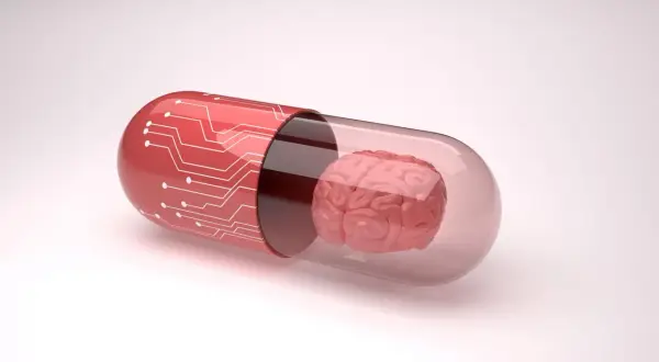 Czerwona kapsułka z obwodami drukowanymi zawiera mózg, symbolizując potencjalne leki, np. inhibitory MAO, wpływające na funkcje poznawcze.