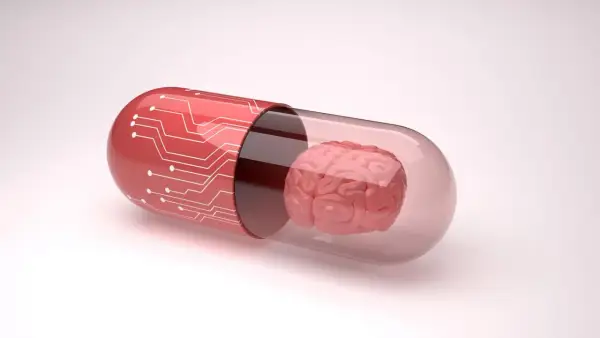 Czerwona kapsułka z obwodami drukowanymi zawiera mózg, symbolizując potencjalne leki, np. inhibitory MAO, wpływające na funkcje poznawcze.